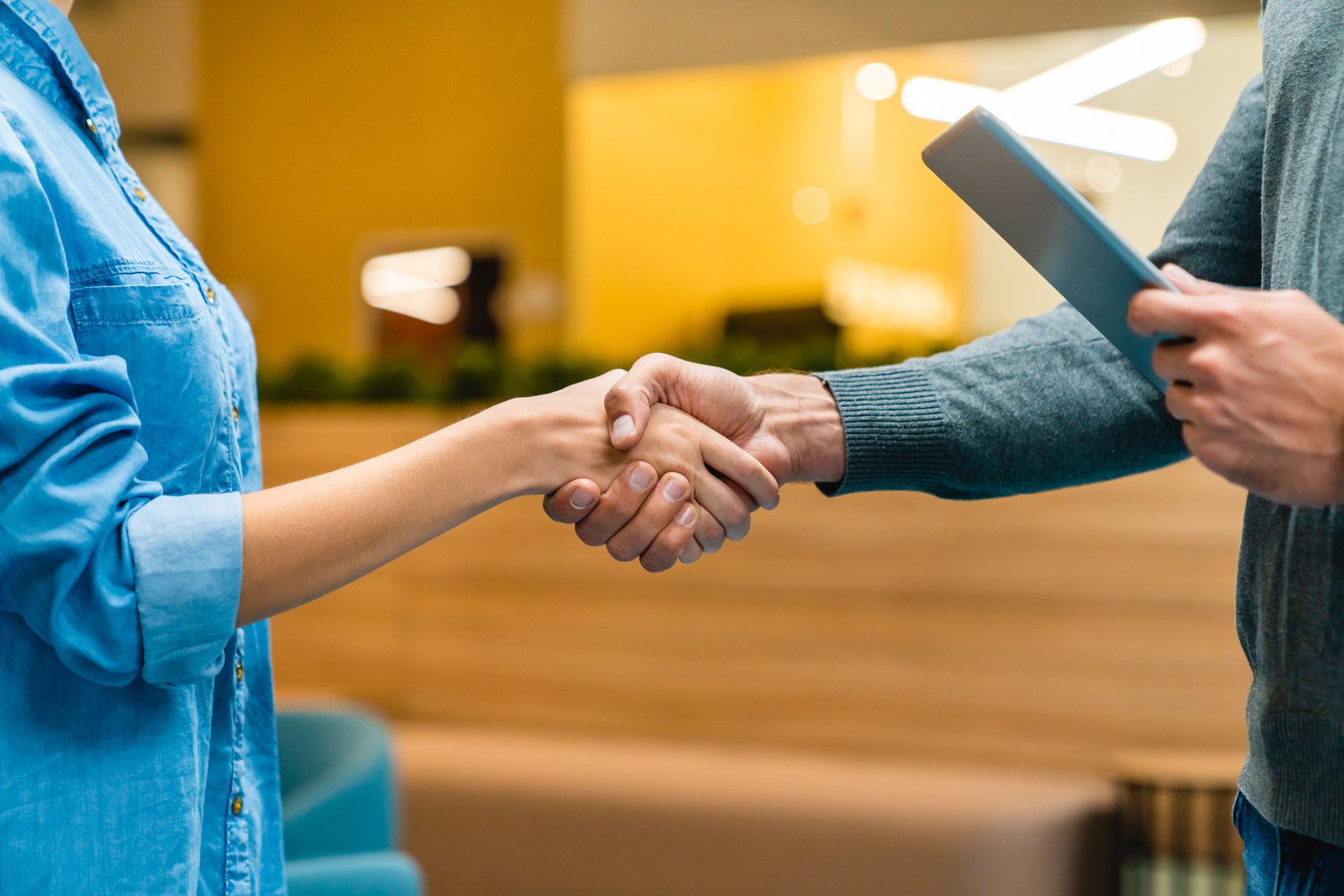 Close up photo of shaking hands in office